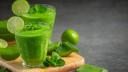 two glasses of aloe vera  juice put on wooden cutting board